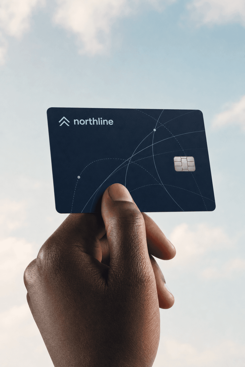 Hand holding a Northline brand card with navy field, ice-blue route pattern, and logo